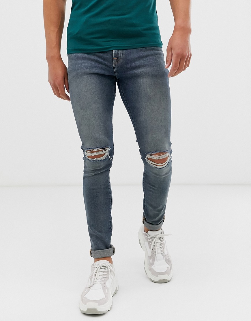ASOS DESIGN - Jeans super skinny 12,5 once lavaggio blu medio con strappi alle ginocchia e sul retro