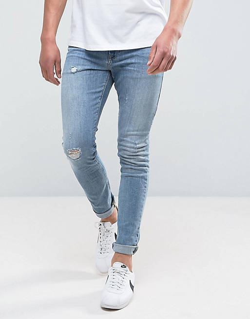ASOS DESIGN - Jeans super skinny blu medio slavato con abrasioni