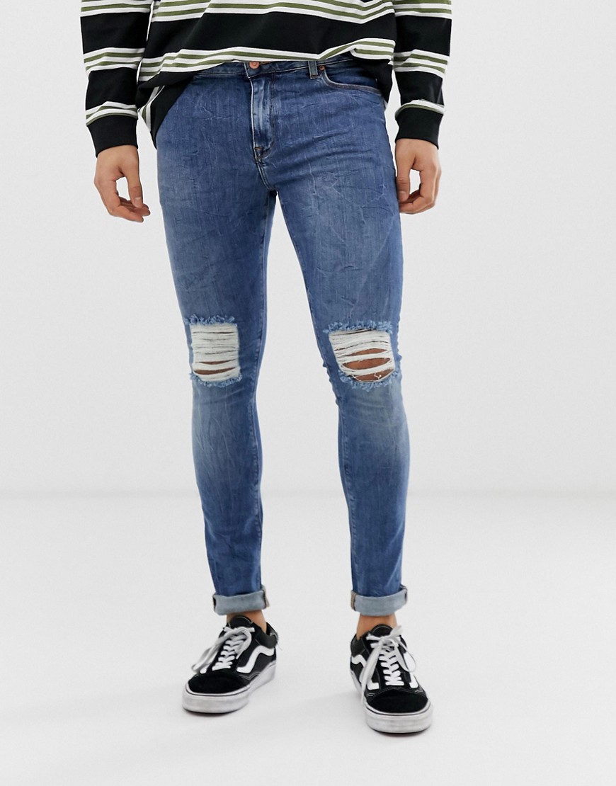ASOS DESIGN - Jeans super skinny da 12,5 once blu medio slavato con strappi sulle ginocchia
