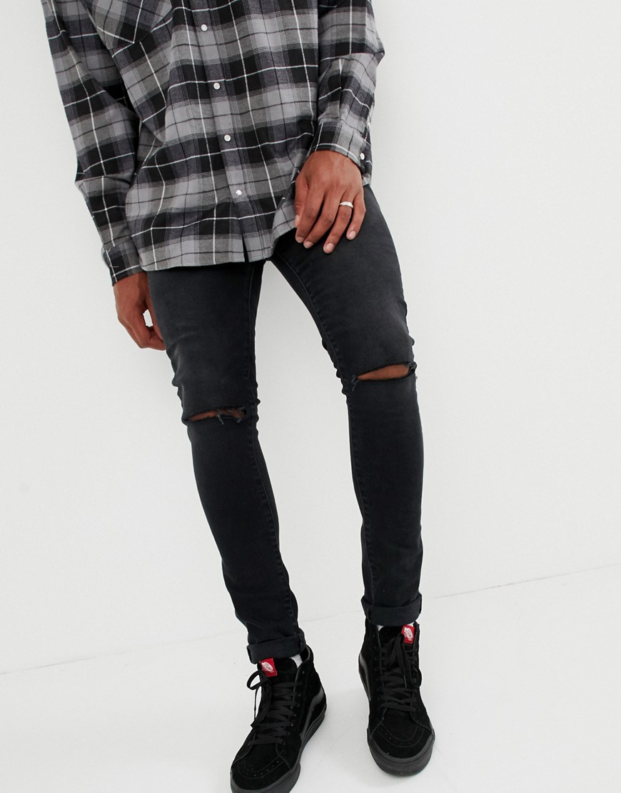 ASOS DESIGN - Jeans super skinny da 12,5 oz neri con strappi alle ginocchia-Nero