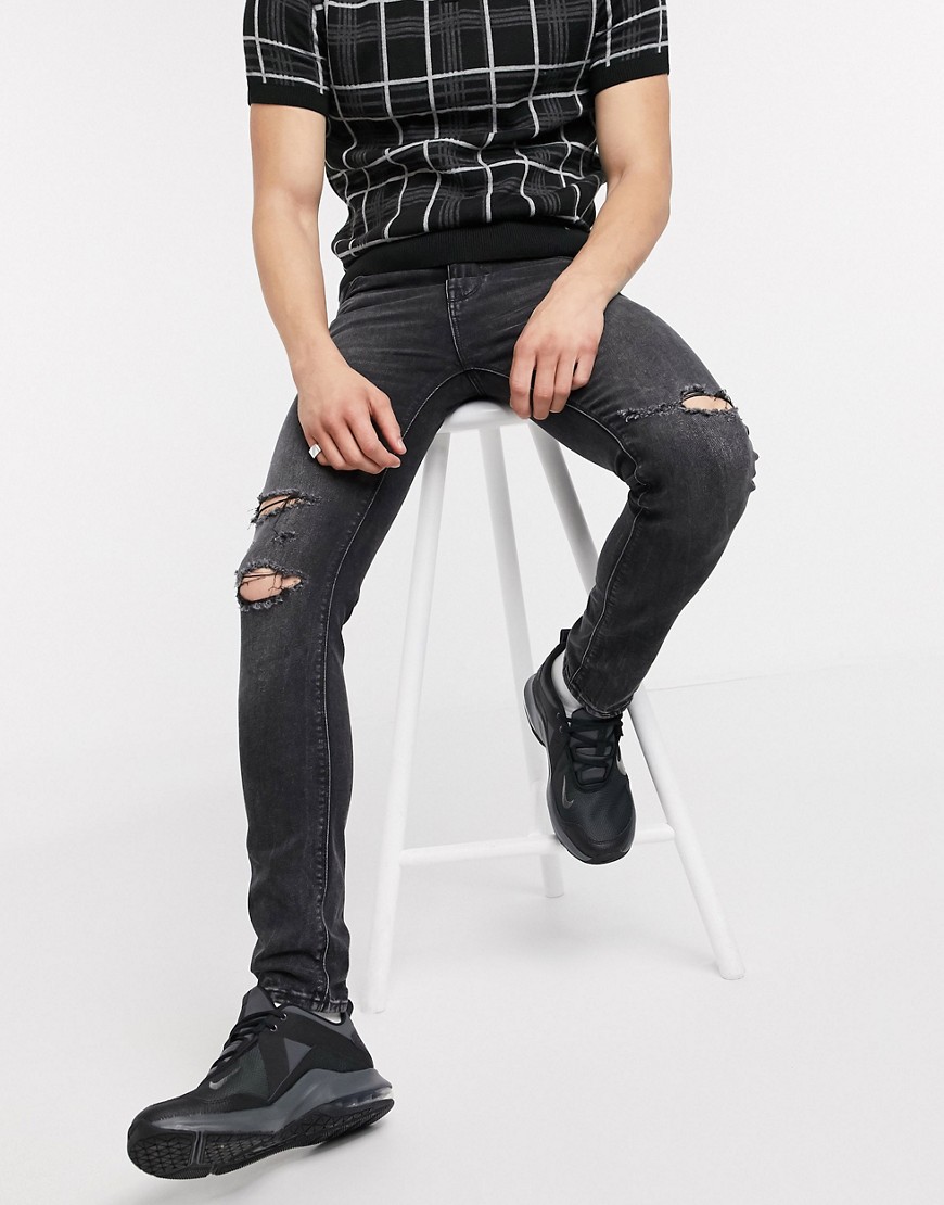 ASOS DESIGN - Jeans super skinny nero slavato con strappi alle ginocchia