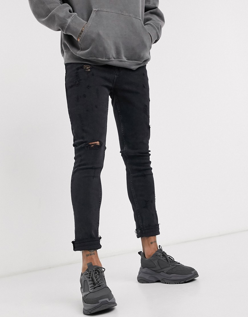 ASOS DESIGN - Jeans super skinny nero slavato strappati