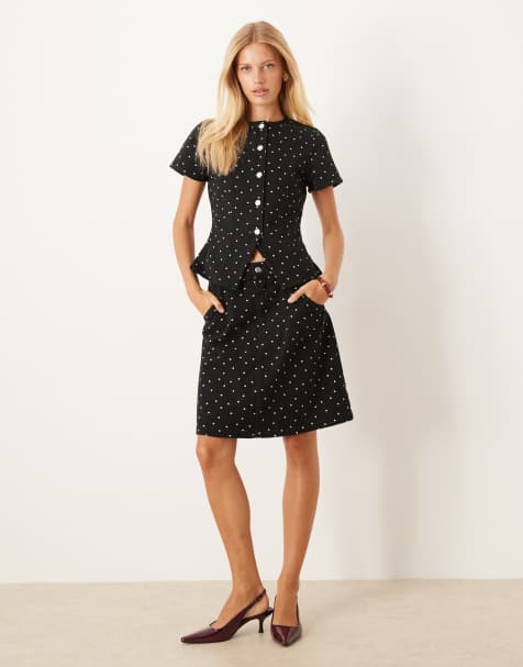 ASOS DESIGN awkward length denim skirt with mini polka dot