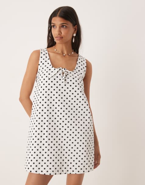 ASOS DESIGN denim scoop mini dress with bow front in polka dot