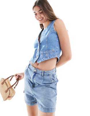 ASOS DESIGN - Jeansweste im Western-Stil in Mittelblau