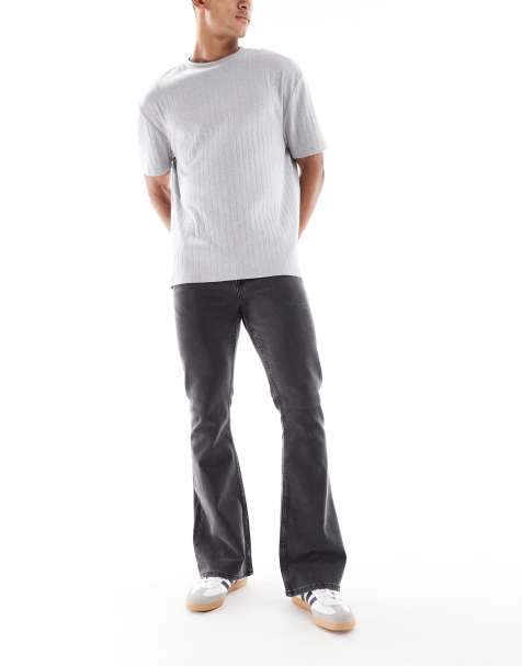 ASOS DESIGN – Jeansy dzwony ze stretchem w spranym czarnym kolorze - view 1