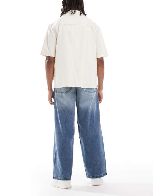 ASOS DESIGN jeansy o bardzo luźnym kroju w średnim niebieskim spraniu z odcieniem, 2 z 5
