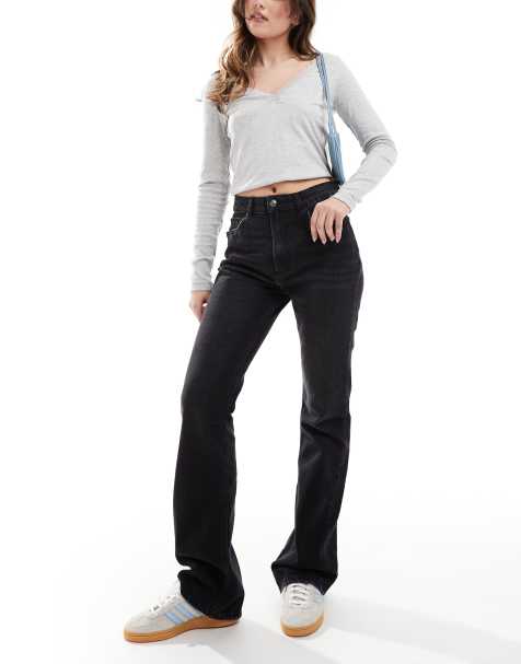ASOS DESIGN – Jeansy z rozszerzanymi nogawkami i średnim stanem w spranym kolorze czarnym - view 1