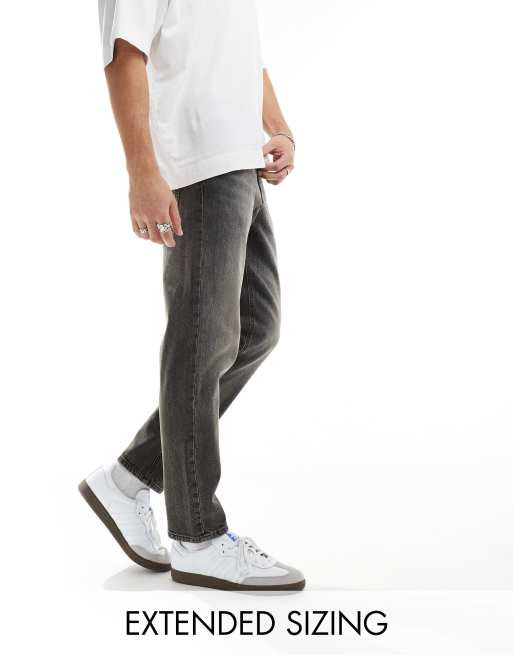 ASOS DESIGN – Jeansy ze zwężanymi nogawkami i stretchem w spranym czarnym kolorze