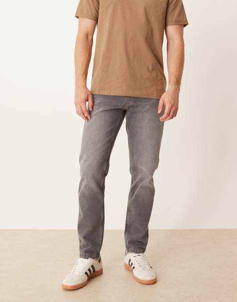 ASOS DESIGN – Jeansy ze zwężanymi nogawkami w spranym czarnym kolorze - view 1