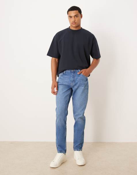 ASOS DESIGN tapered jeans in mid wash 