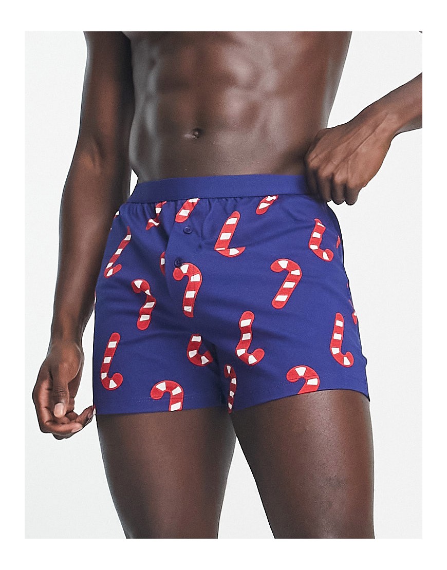 ASOS DESIGN jersey boxers in navy with Christmas candy cane print
