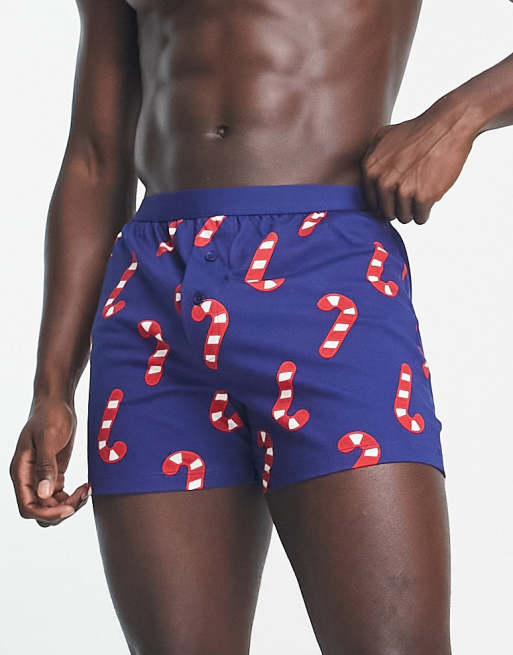 ASOS DESIGN jersey boxers in navy with Christmas candy cane print