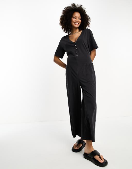 ASOS DESIGN jersey overalls in black with side stripe