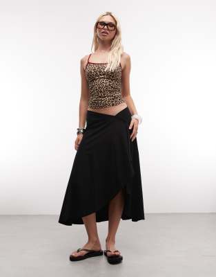 ASOS DESIGN jersey hanky hem skirt with button detail in black
