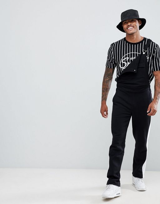 ASOS DESIGN jersey overalls in black with side stripe