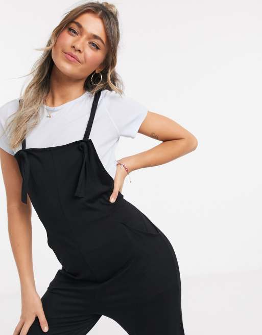 ASOS DESIGN jersey overalls in black with side stripe