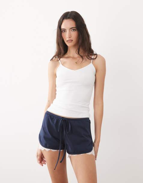 ASOS DESIGN jersey shorts with lace under layer in navy - view 1