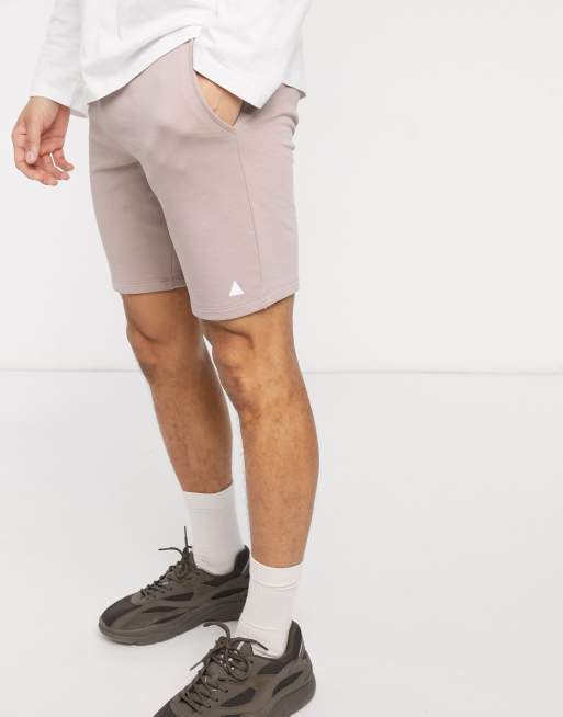 ASOS DESIGN jersey skinny shorts in beige with triangle