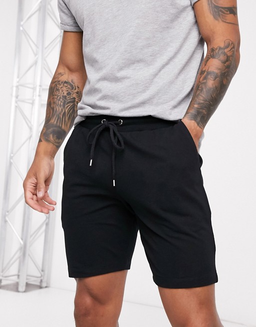 ASOS DESIGN jersey skinny shorts in black pique