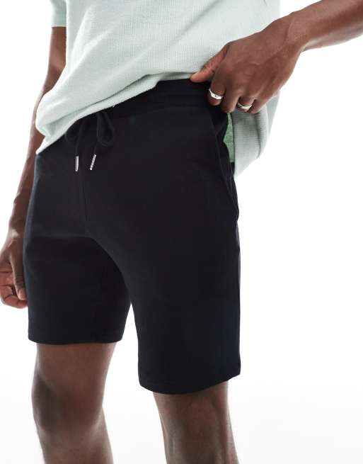 ASOS DESIGN jersey skinny shorts in black