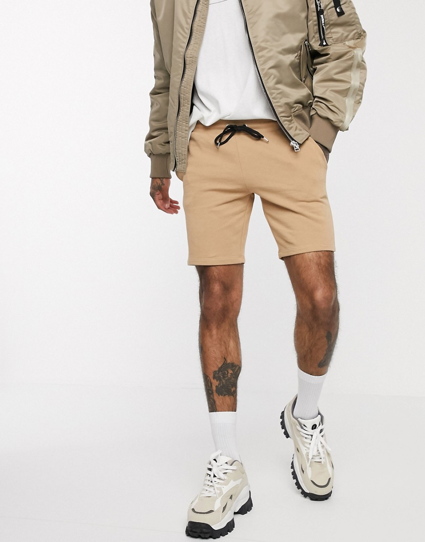 ASOS DESIGN jersey skinny shorts in tan-Brown