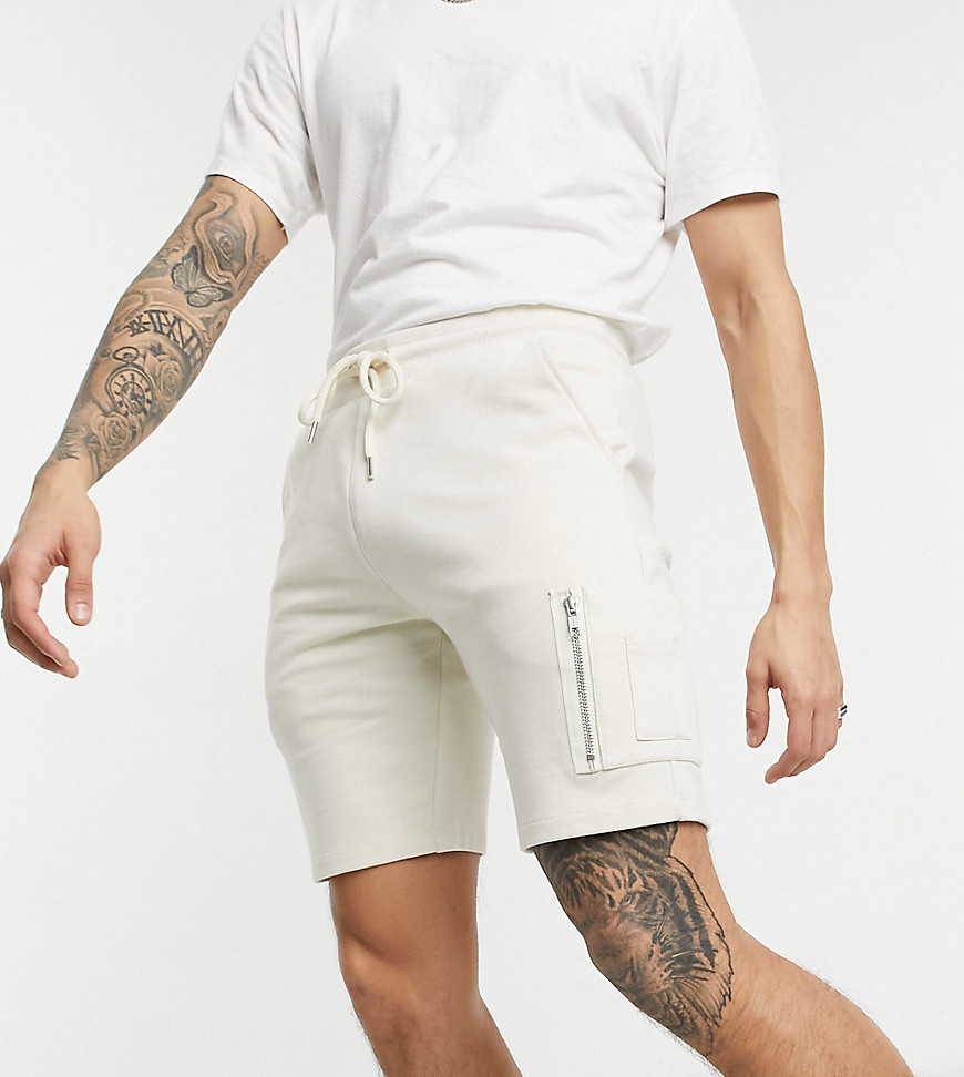 ASOS DESIGN jersey skinny shorts with MA1 pocket in beige-Neutral