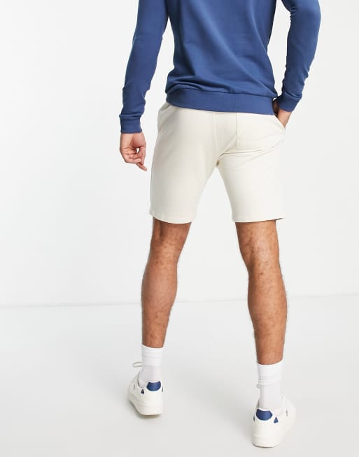 ASOS DESIGN jersey skinny shorts with pintucks in beige