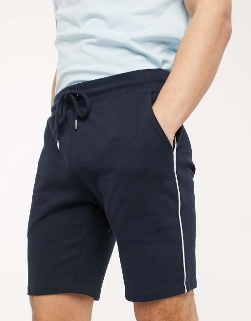 ASOS DESIGN jersey skinny shorts with piping in navy ASOS