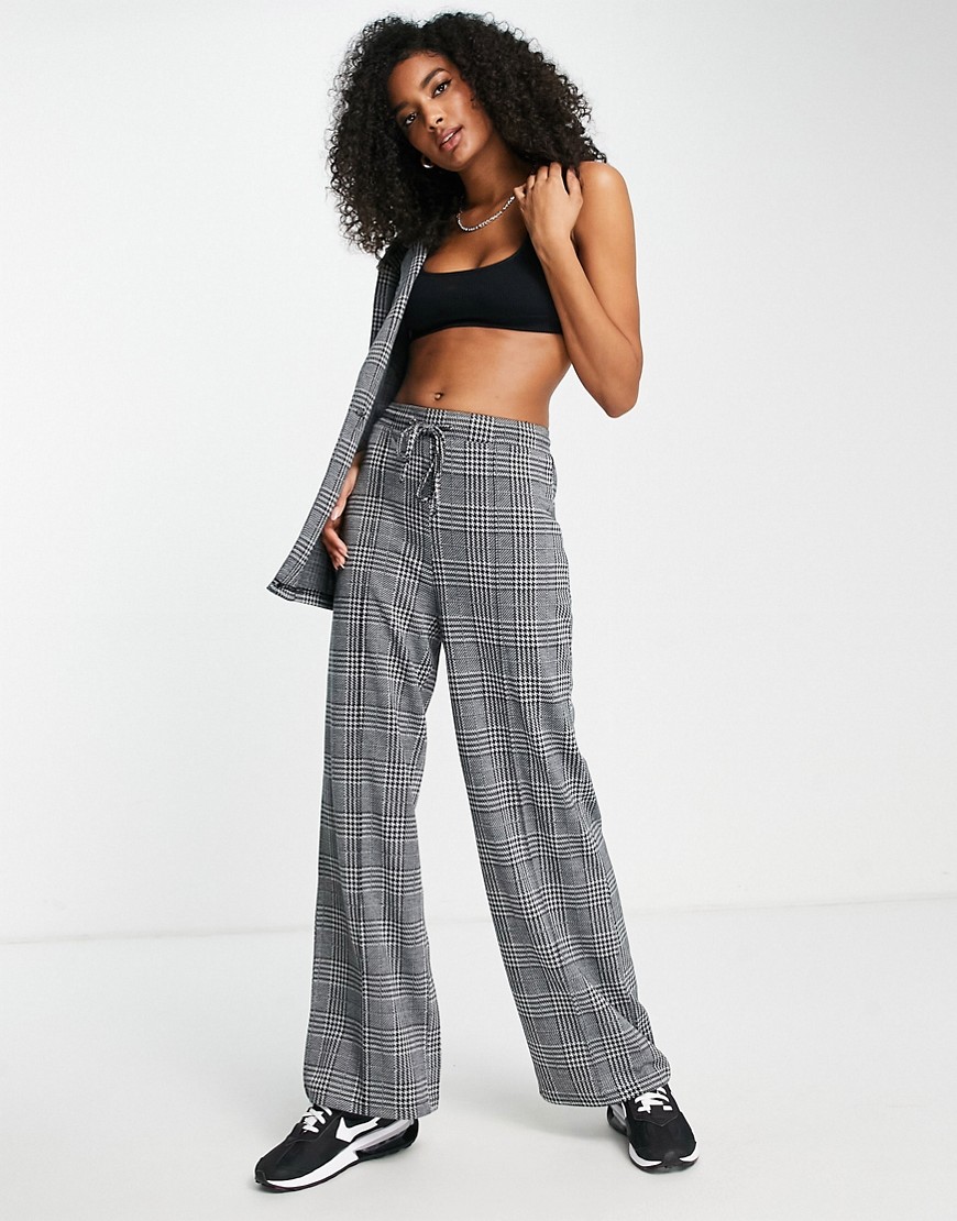 ASOS DESIGN jersey slouch wide leg suit pants in prince of wales check-Multi