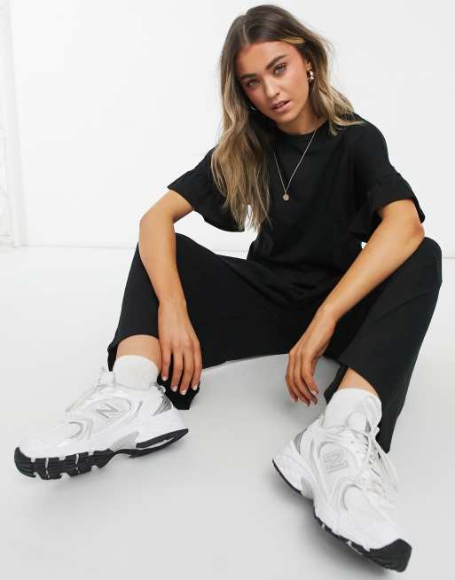 ASOS DESIGN jersey smock jumpsuit with frill sleeve in black ASOS