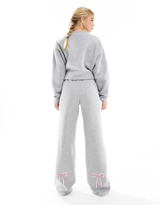 Grey sweatsuit. Hoodie with logo in the middle and matching sweatpants