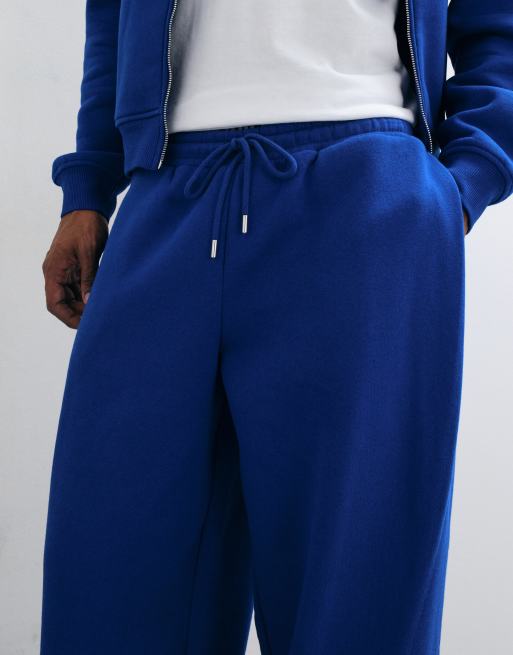 ASOS DESIGN jogger de conjunto extragrande de corte globo con pinza lateral en azul, 3 de 5
