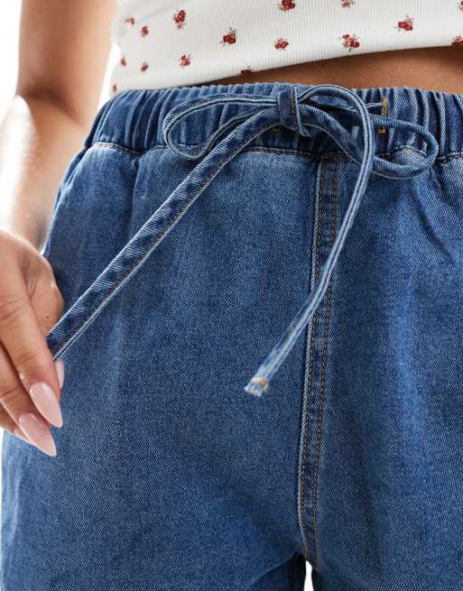 ASOS DESIGN jogger style denim pull on short in mid blue
