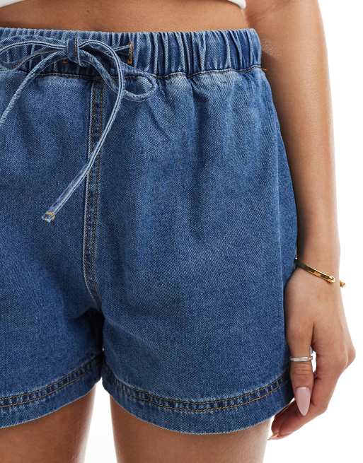 ASOS DESIGN jogger style denim pull on short in mid blue