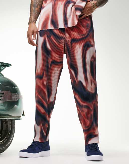 ASOS DESIGN - Joggers affusolati a pieghe con stampa ondulata in coordinato