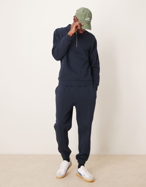 ASOS DESIGN - Joggers affusolati blu navy con pinces in coordinato