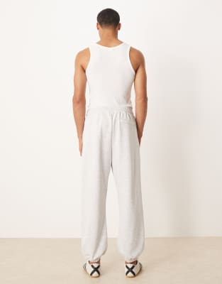 ASOS DESIGN - Joggers affusolati grigio mélange con rovescio a ricci | ASOS