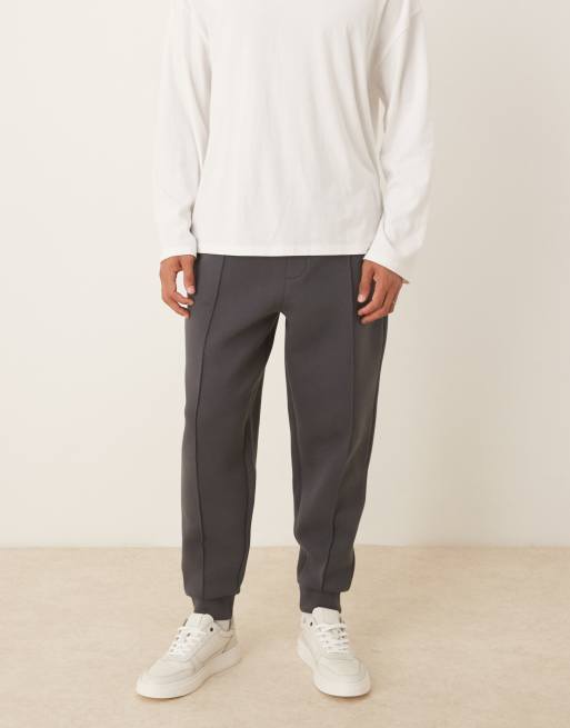 ASOS DESIGN - Joggers affusolati in tessuto effetto scuba con pinces color antracite