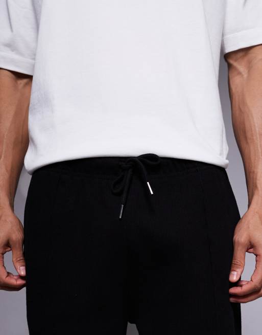 ASOS DESIGN - Joggers affusolati in tessuto pesante neri con orlo fisso e pinces, 5 di 5