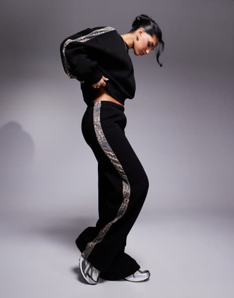 ASOS DESIGN - Joggers con fondo ampio neri con riga laterale leopardata in coordinato - view 1