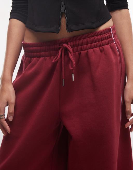 ASOS DESIGN joggers med paneler och extra vida ben med passepoaldetaljer i vinröd och lila, 3 av 5