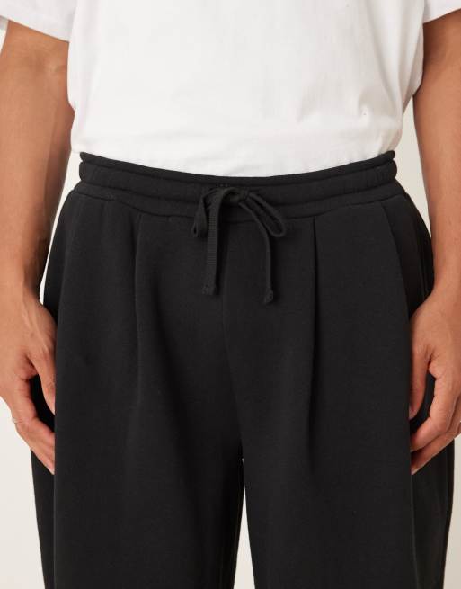 ASOS DESIGN - Joggers neri con fondo ampio e pieghe, 4 di 5