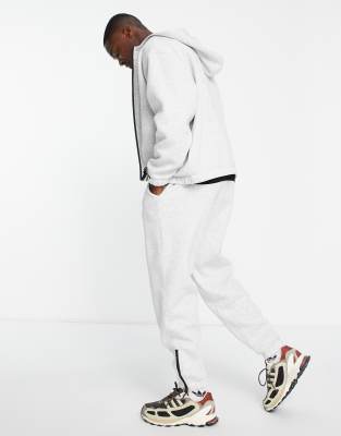 ASOS DESIGN - Joggers oversize bianco mélange con bordi sportivi con zip in coordinato