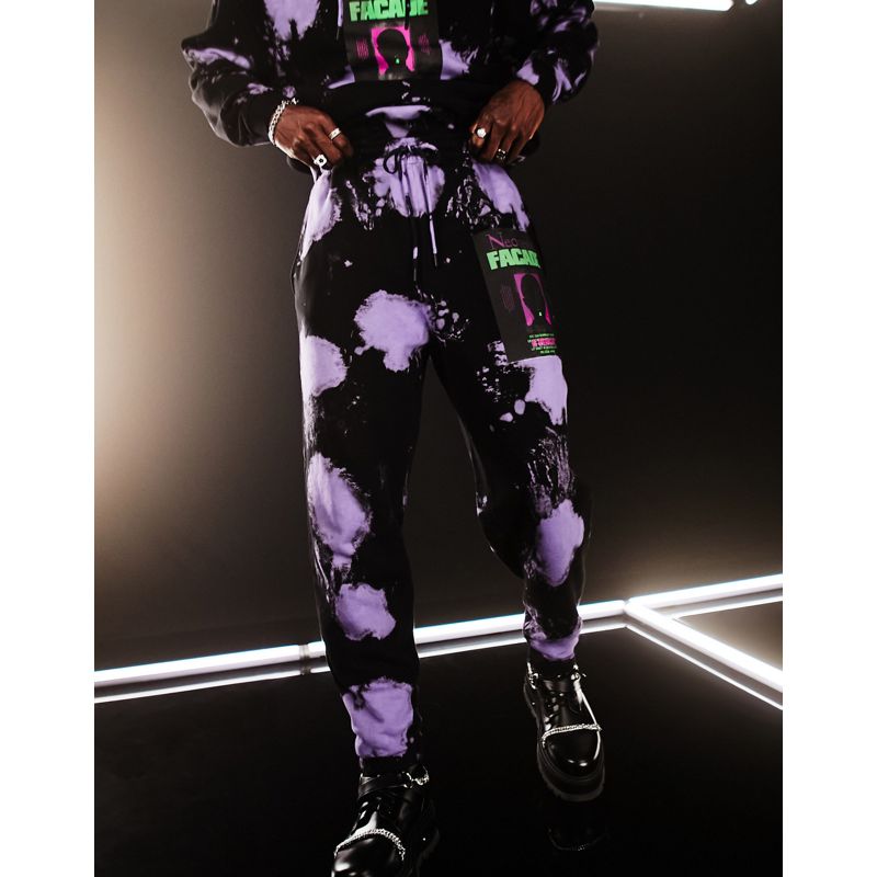 nfr8L Uomo DESIGN - Joggers oversize neri e viola tie-dye con scritta