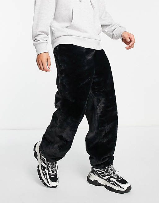 Joggers oversize neri in pelliccia sintetica Asos Uomo Abbigliamento Pantaloni e jeans Pantaloni Joggers 