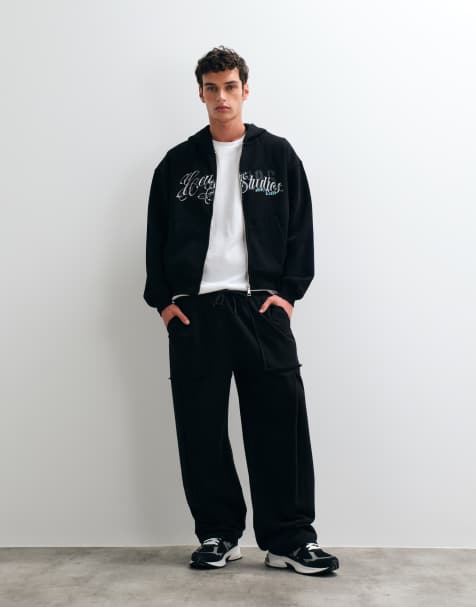 ASOS DESIGN joggery z szerokimi nogawkami z kieszeniami cargo w czarnym polibawełnianym materiale - view 1