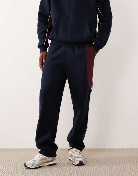 ASOS DESIGN - Joggingbroek met rechte pijpen en 'cut-and-sew detail' in marineblauw - view 1
