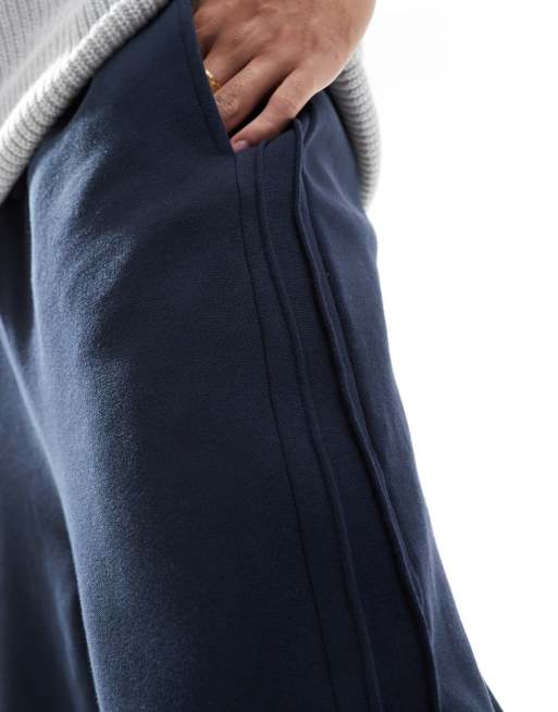 ASOS DESIGN - Joggingbroek met wijde pijpen en plooi in marineblauw, 3 van 5