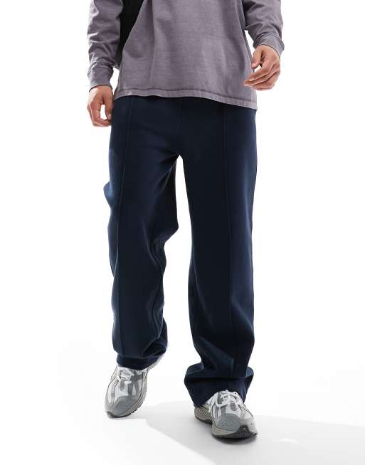 ASOS DESIGN - Joggingbroek met wijde pijpen en siernaden in marineblauw